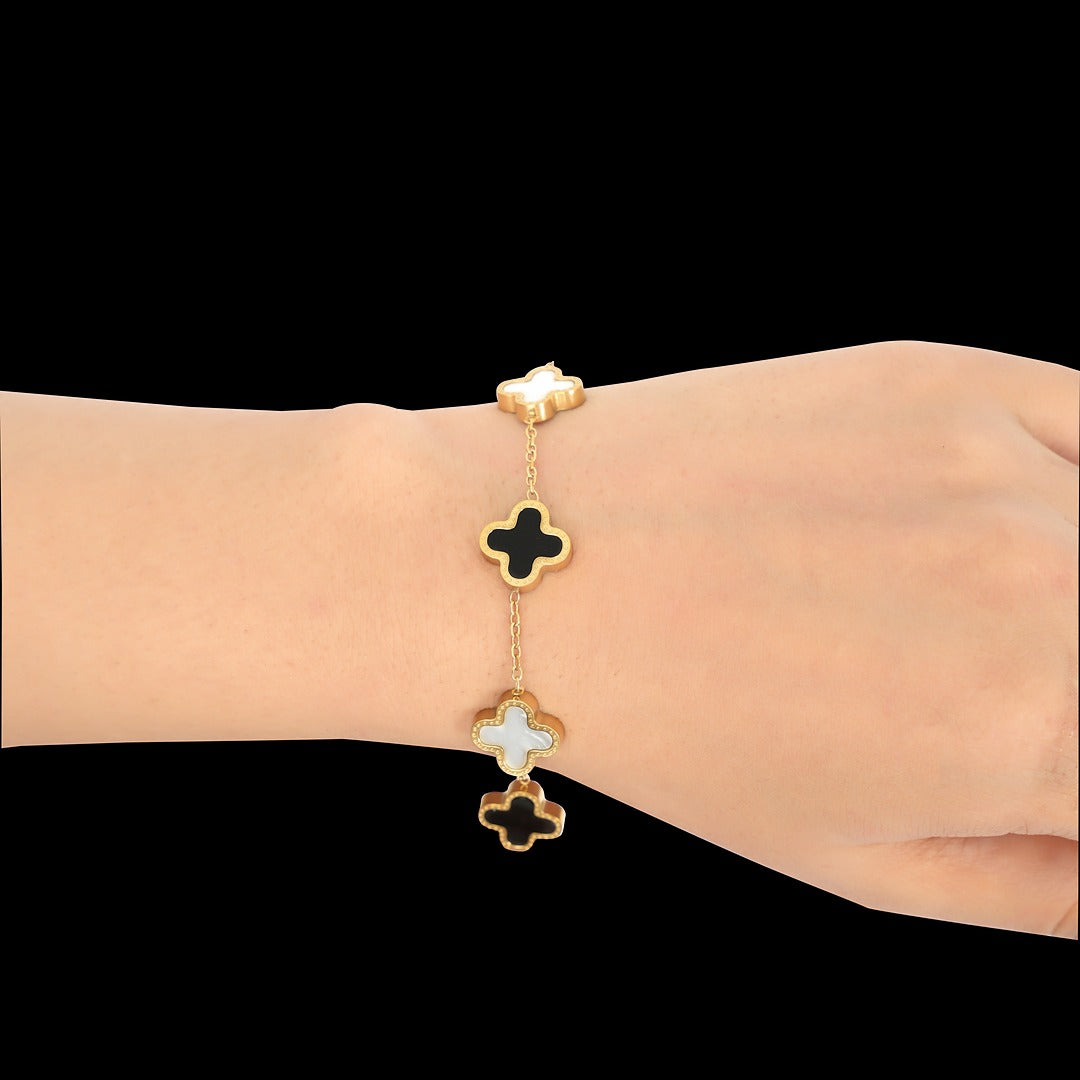 Elegant Gold & Enamel Clover Bracelet - Black and White Charm